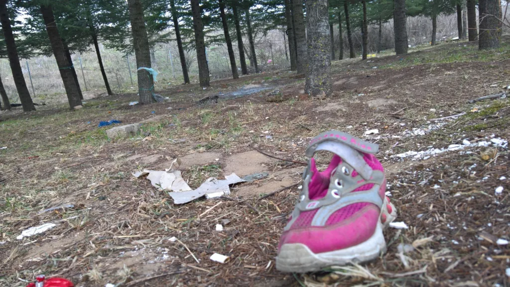 Abandoned shoe of a girl in the camp